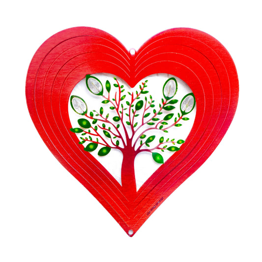 Red heart-shaped wind spinner with a tree of life design on a white background